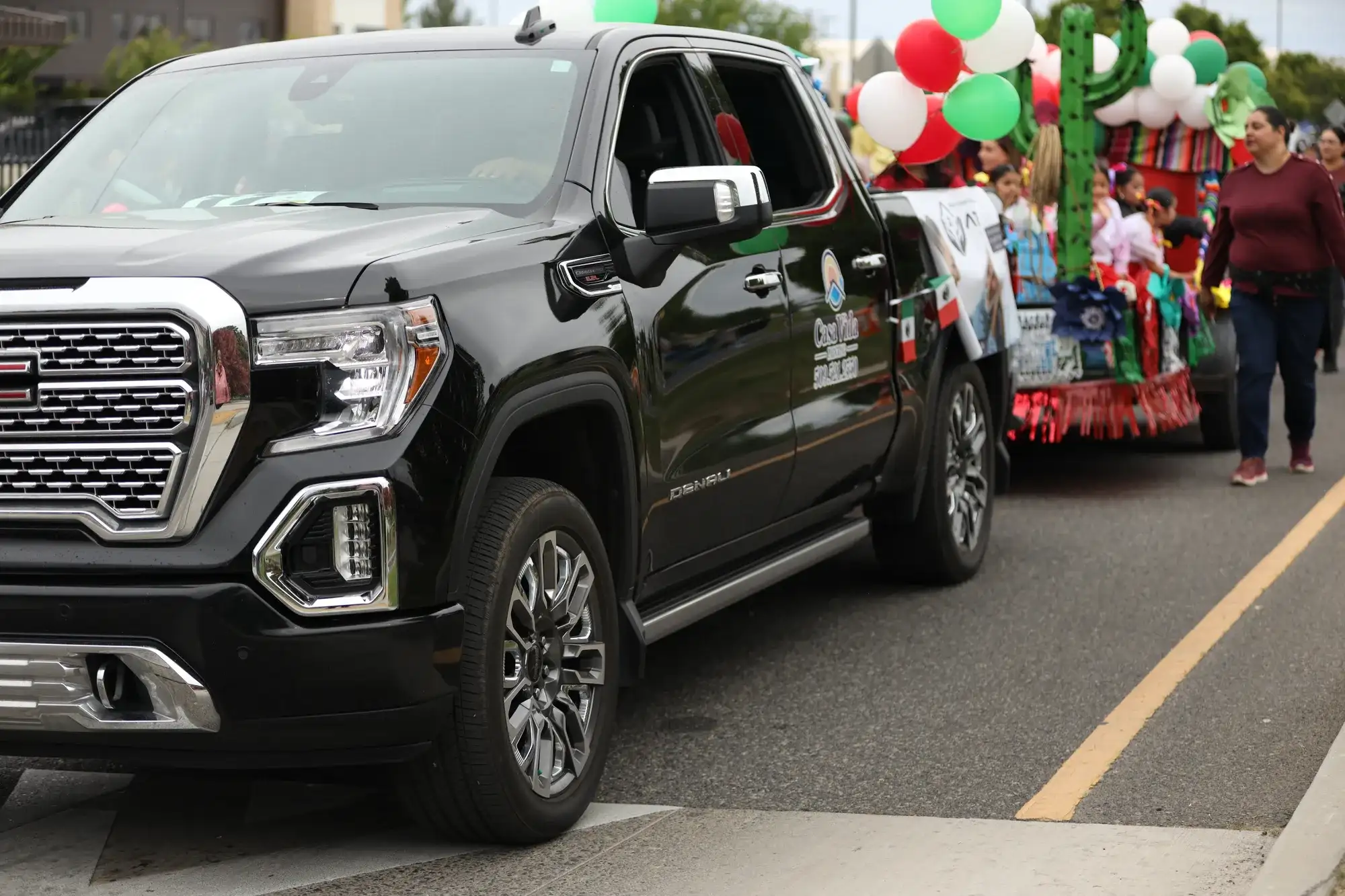 Casa Vida truck pulling a festive float in a local parade