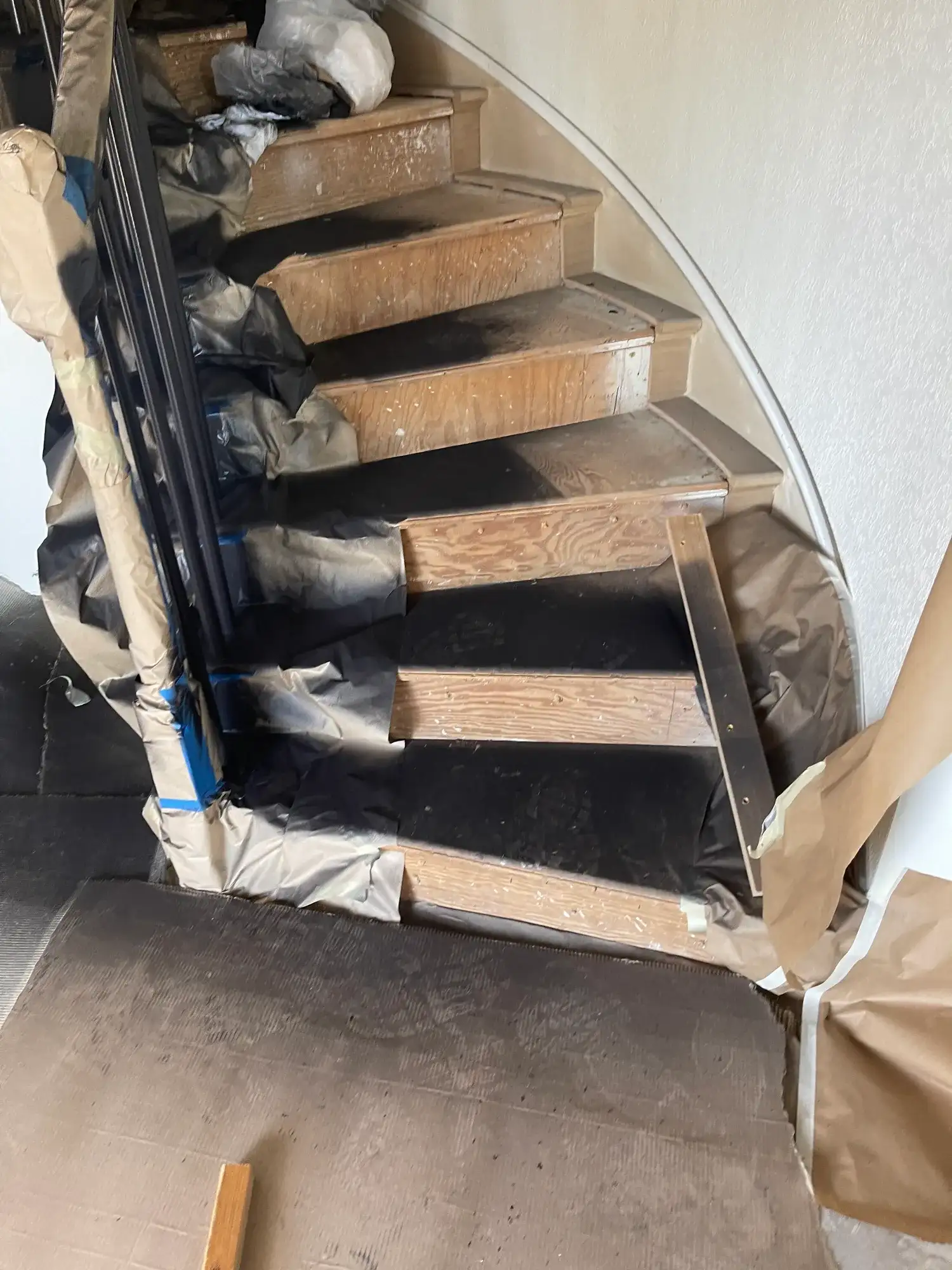 Stairs masked with paper and tape during prep
