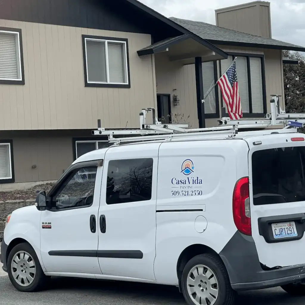White Casa Vida van parked at a two-story home during a job
